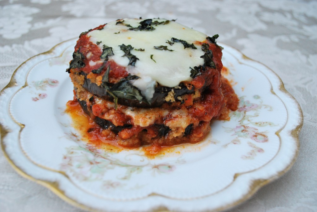 A serving of Baked Eggplant Parmesan on a white plate.