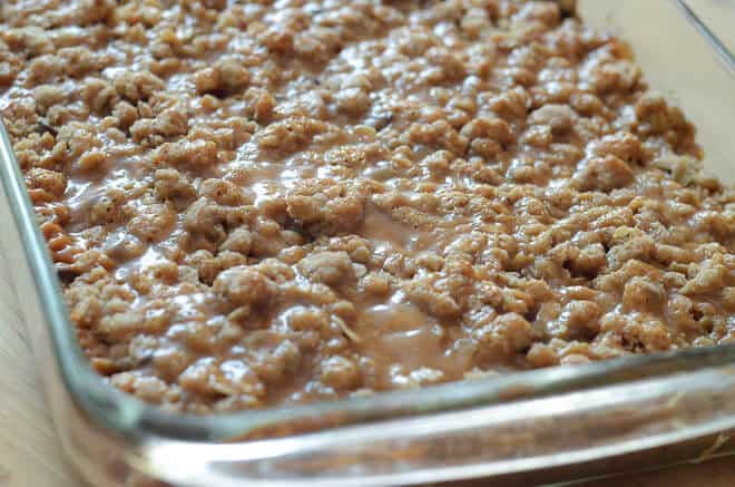 A close up image of Caramel Oat Bars in a glass baking dish.
