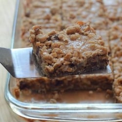 A piece of cake on a plate, with Caramel and Oat