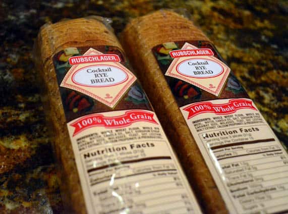 Two packages of Cocktail Rye Bread on a kitchen counter.