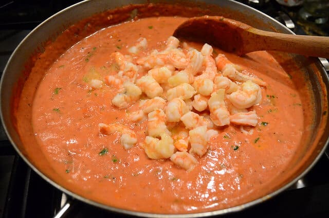 Cooked shrimp is added to the sauce.