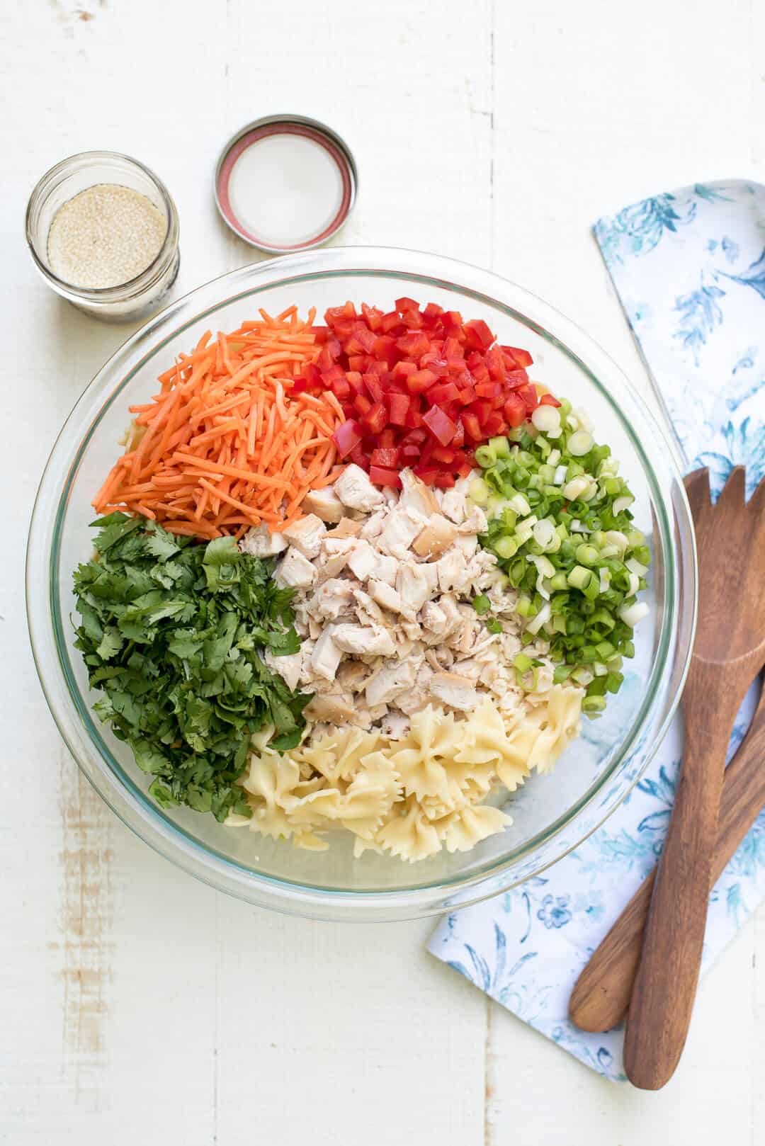 An in process image that shows all the ingredients in a glass mixing bowl.