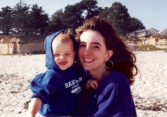 A baby picture of Boy #3 and Valerie at the beach.