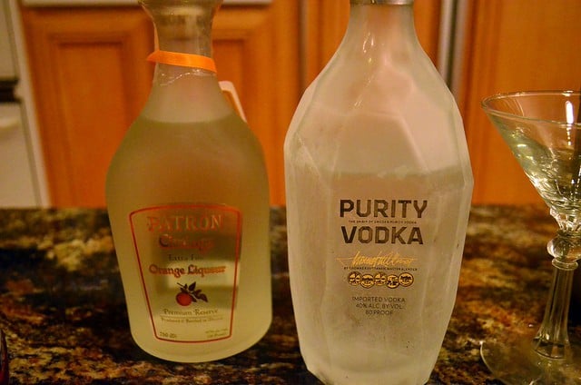 a bottle of Patron Citronge orange liqueur next to a chilled bottle of Purity Vodka.