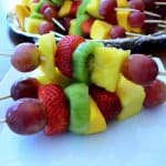 A stack of fruit kabobs.