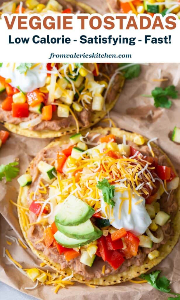 A close up of a vegetarian tostada with avocado and cheese with overlay text.