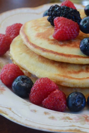 A plate of pancakes with berries.