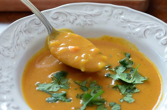 A spoonful of Sweet Potato Coconut Curry Soup.