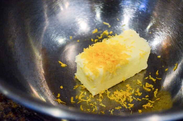 Butter and lemon zest in a bowl.