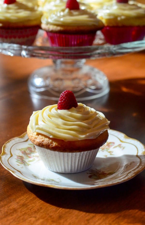 Lemon Raspberry Cupcake with Lemon Curd Frosting served on a dish.
