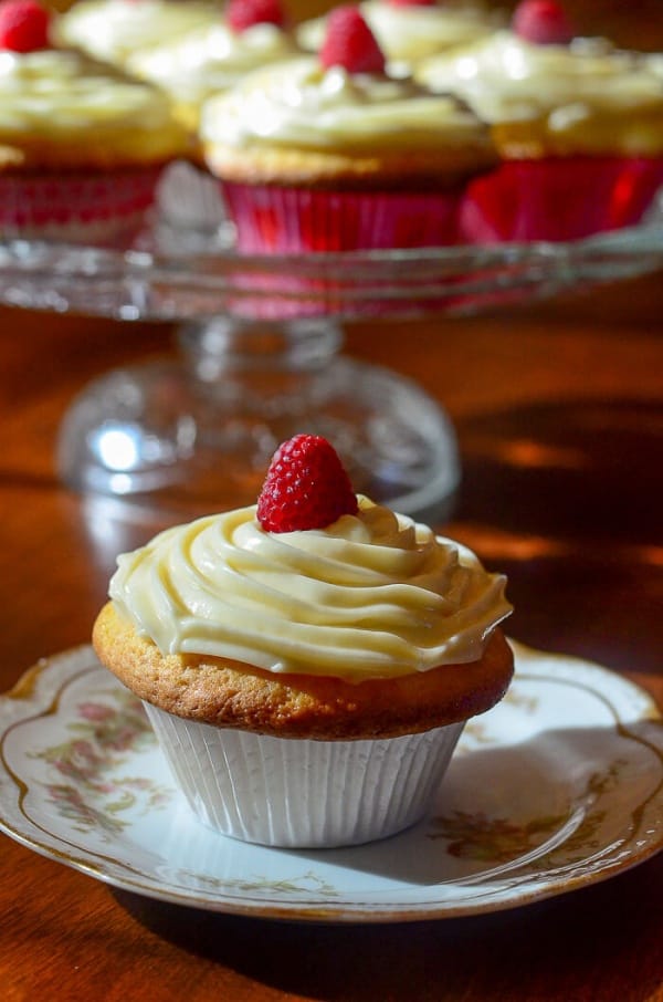 Lemon Raspberry Cupcake served on a plate.