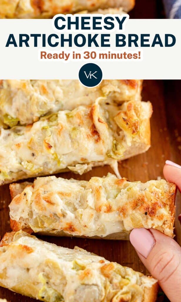 A close up of fingers holding a slice of Cheesy Artichoke Bread with overlay text.