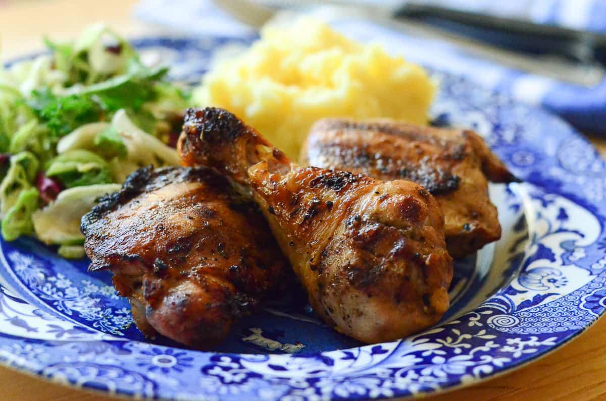Grilled chicken on a blue plate.