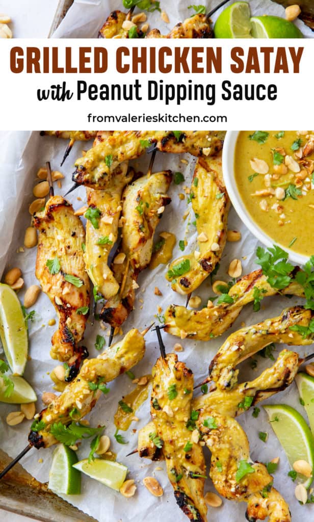 Grilled Chicken Satay with Peanut Sauce on a baking sheet with text overlay.