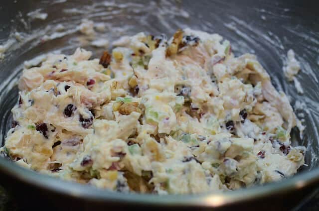 Crunchy Sweet Chicken Salad in a metal mixing bowl just after it has been mixed together.