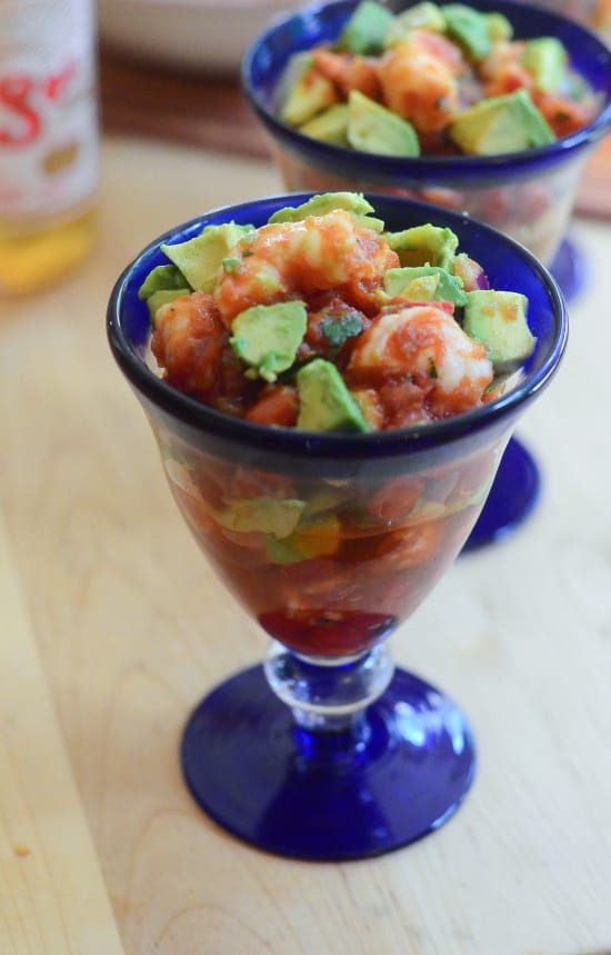 The sliced avocado is added to the Mexican Shrimp Cocktail.