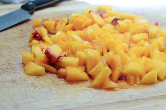 A peach cut into slices.