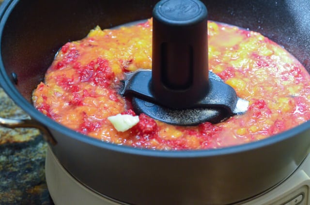 Crushed fruit is added to the jam maker.