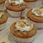 Cupcakes with a creamy frosting and walnuts on top.