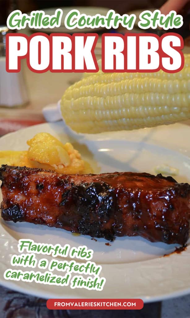 Butter being spread on an ear of corn above a plate with a grilled country style pork rib with text overlay.