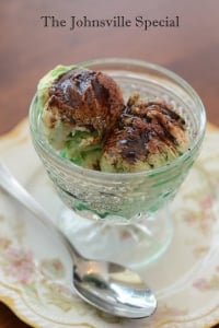 A glass dish filled with ice cream, creme de menthe, and sprinkled with ovaltine.