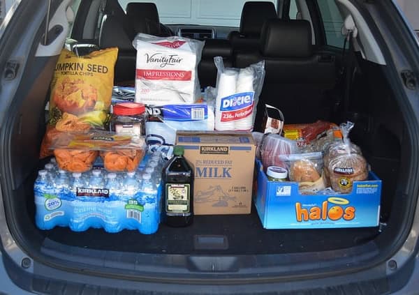 An open car trunk filled with groceries.