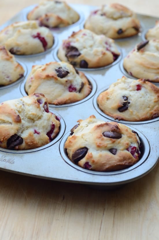 Raspberry Dark Chocolate Muffins in a muffin pan.