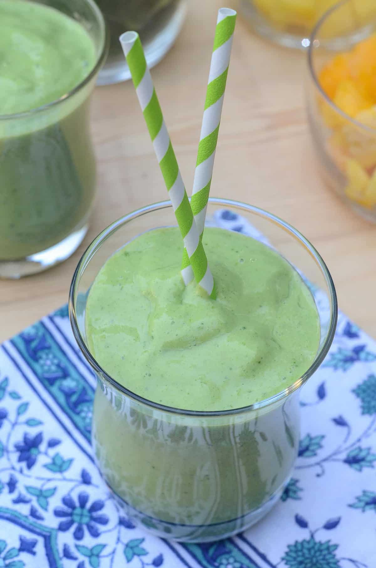 Packed with nutrition and incredible flavor, this creamy Tropical Green Smoothie is a delicious way to start the day!