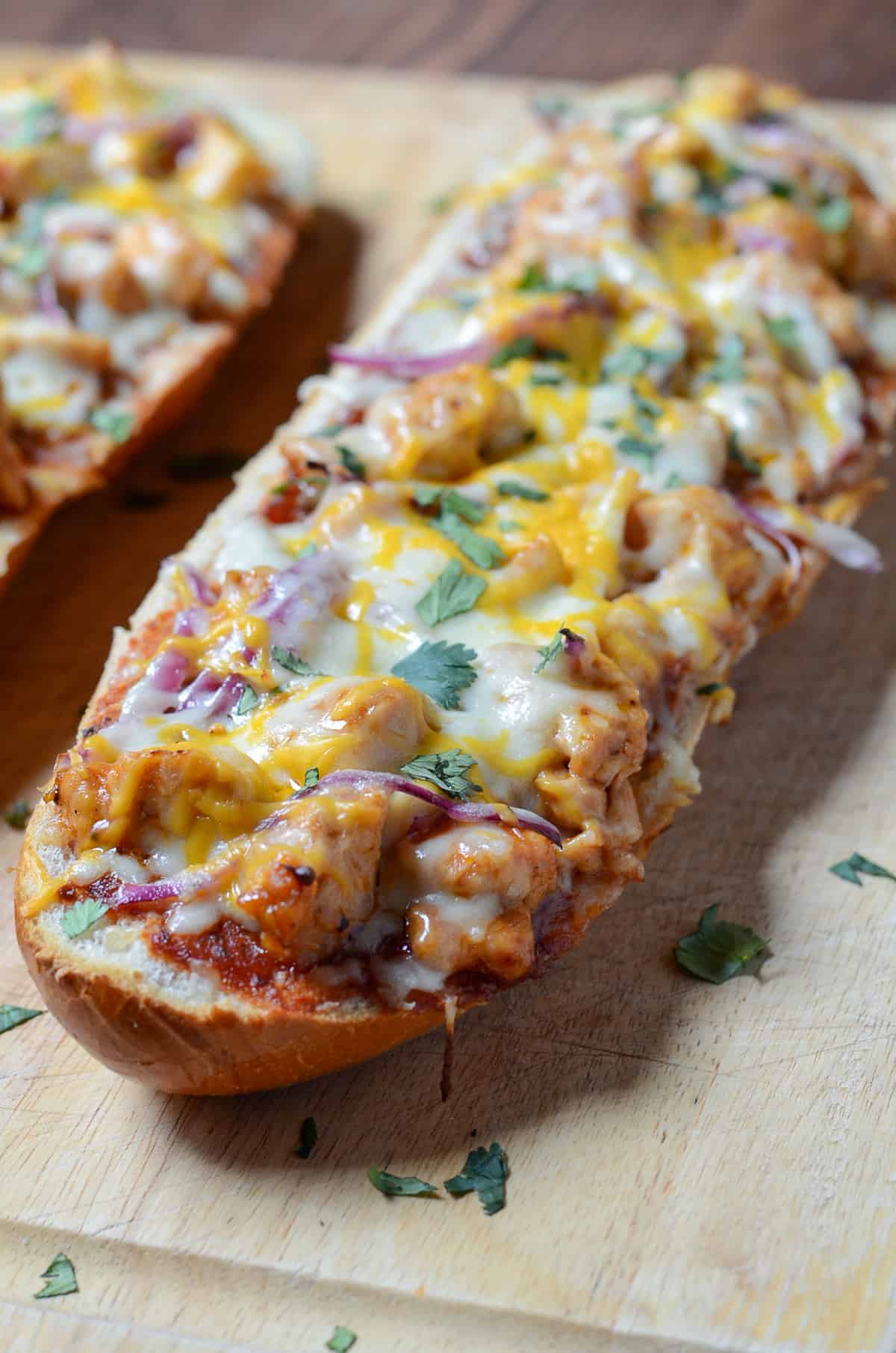 A close up of french bread pizza.