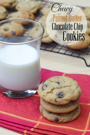 A stack of cookies next to a cup of milk.