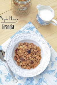 A bowl of granola on a blue and white towel.