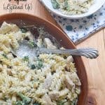 A serving dish filled with pasta and chicken.