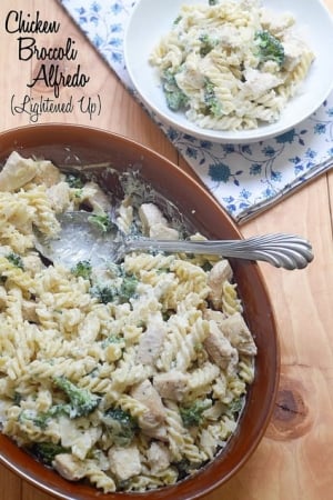 A serving dish filled with pasta, chicken, and broccoli.