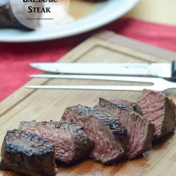 Sliced steak on a cutting board.