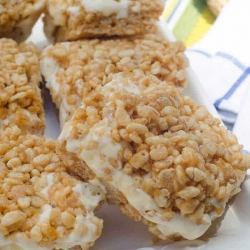 Squares of rice krispie treats filled with ice cream.