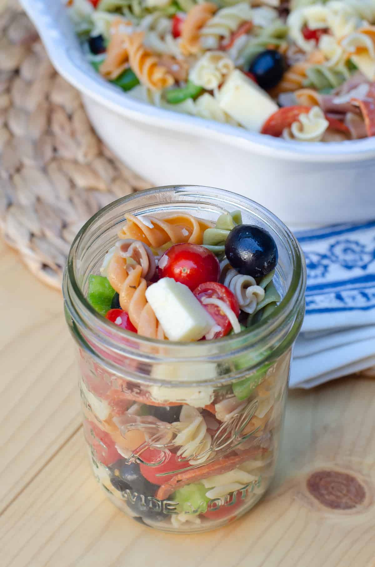 A mason jar filled with pasta salad.