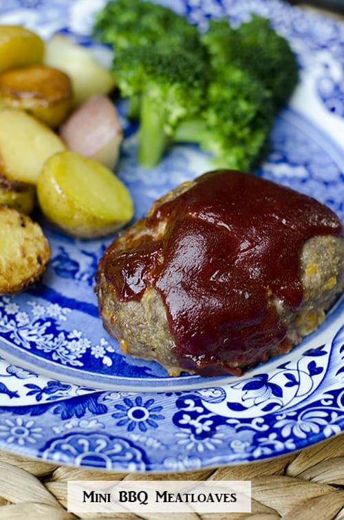 A Mini BBQ Meatloaf on a blue plate with potatoes and broccoli.