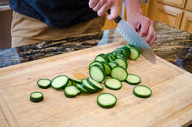 A close up image of the sliced cucumbers.