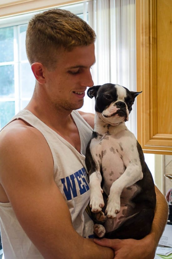 Adam holding Bridget the Boston Terrier.