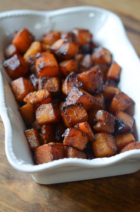 Sweet Spiced Roasted Butternut Squash in a white baking dish.