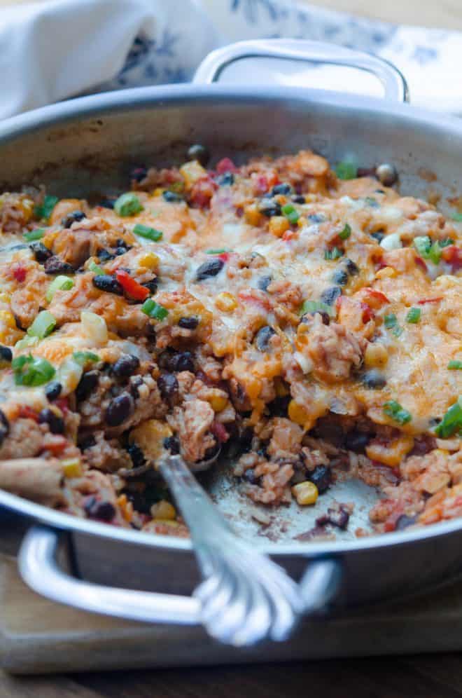Tex-Mex Chicken and Rice Skillet in a stainless steel skillet.