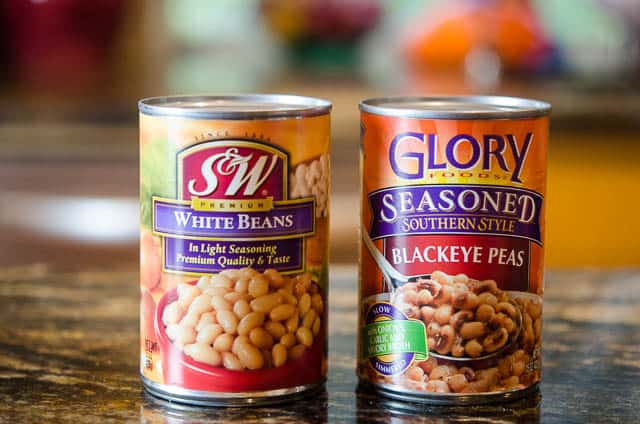 A can of S&W White Beans and Glory Seasoned Blackeye Peas.