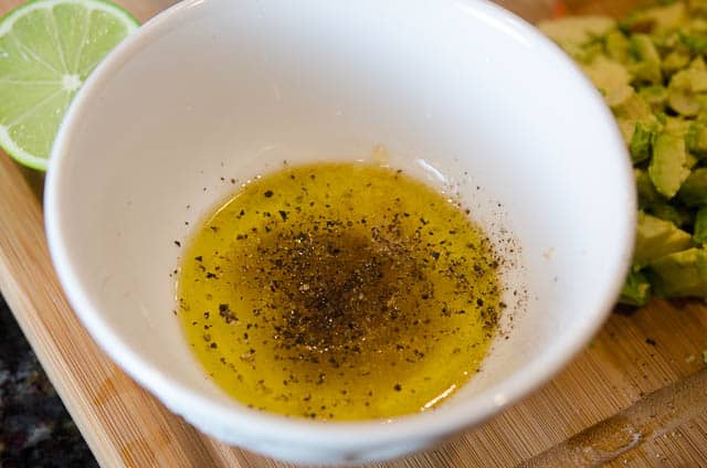 Seasoning is added to the dressing mixture.