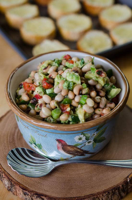 A close up of the White Bean, Black-Eyed Pea, Avocado mixture in a bowl.