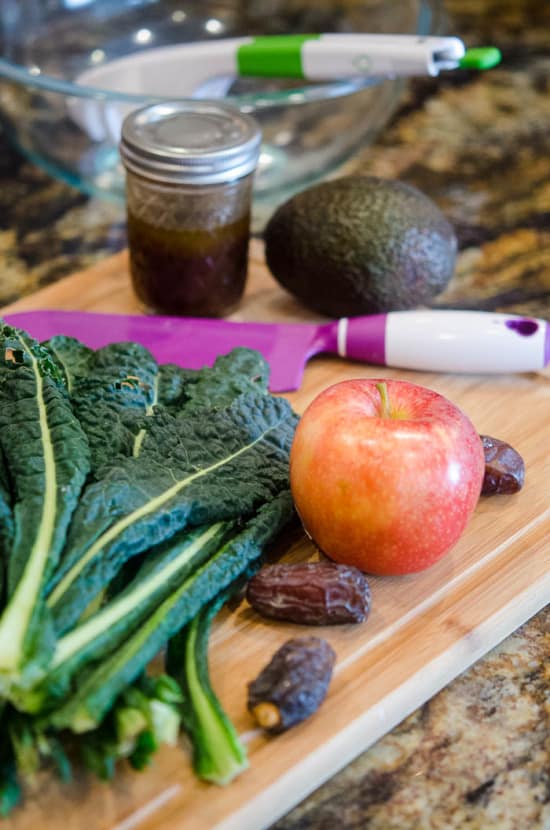 Kale Salad Ingredients on a cutting board.