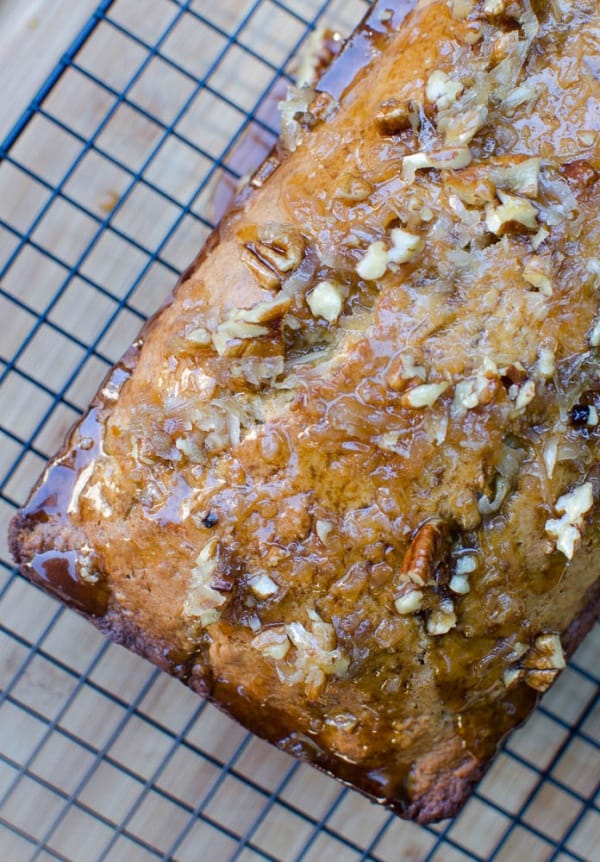 Nut glazed banana bread on a wire rack shot from over the top.