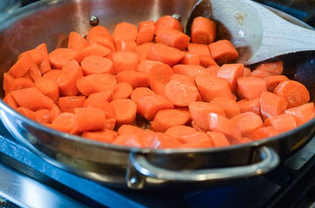 Carrots cooking in a skillet.