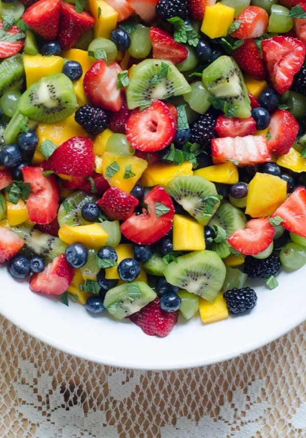 Fruit Salad with Sweet Lime Dressing in a white bowl.