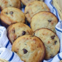 A basket filled with banana oatmeal chocolate chip muffins.