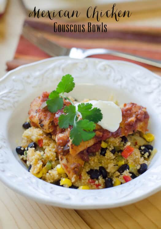 A bowl filled with couscous, black beans, and veggies, topped with chicken.
